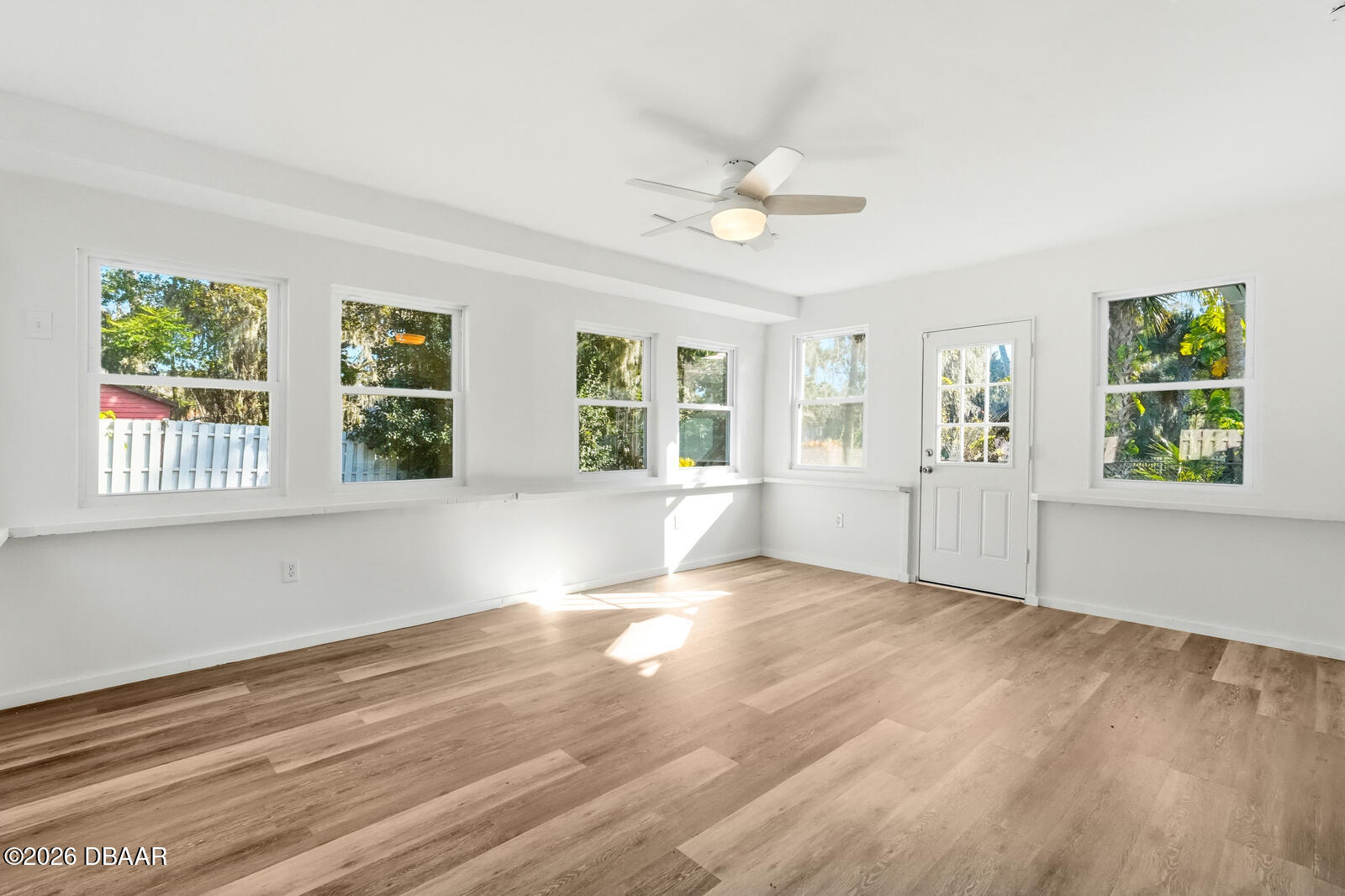 550 Locust Street Port Orange, FL 32127 - Photo 26 of 37 a view of an empty room with wooden floor and a window