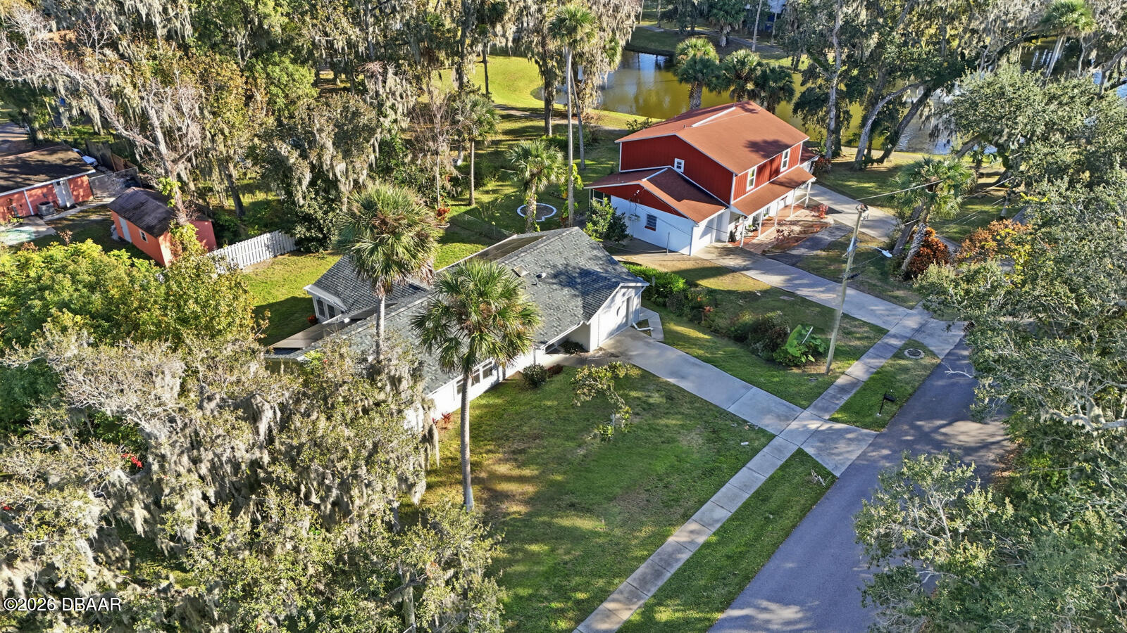 550 Locust Street Port Orange, FL 32127 - Photo 33 of 37 a aerial view of a house with a yard and garden