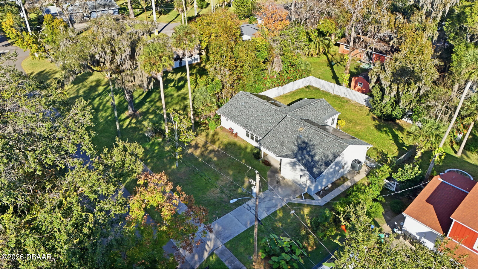 550 Locust Street Port Orange, FL 32127 - Photo 34 of 37 an aerial view of a house with a yard and garden