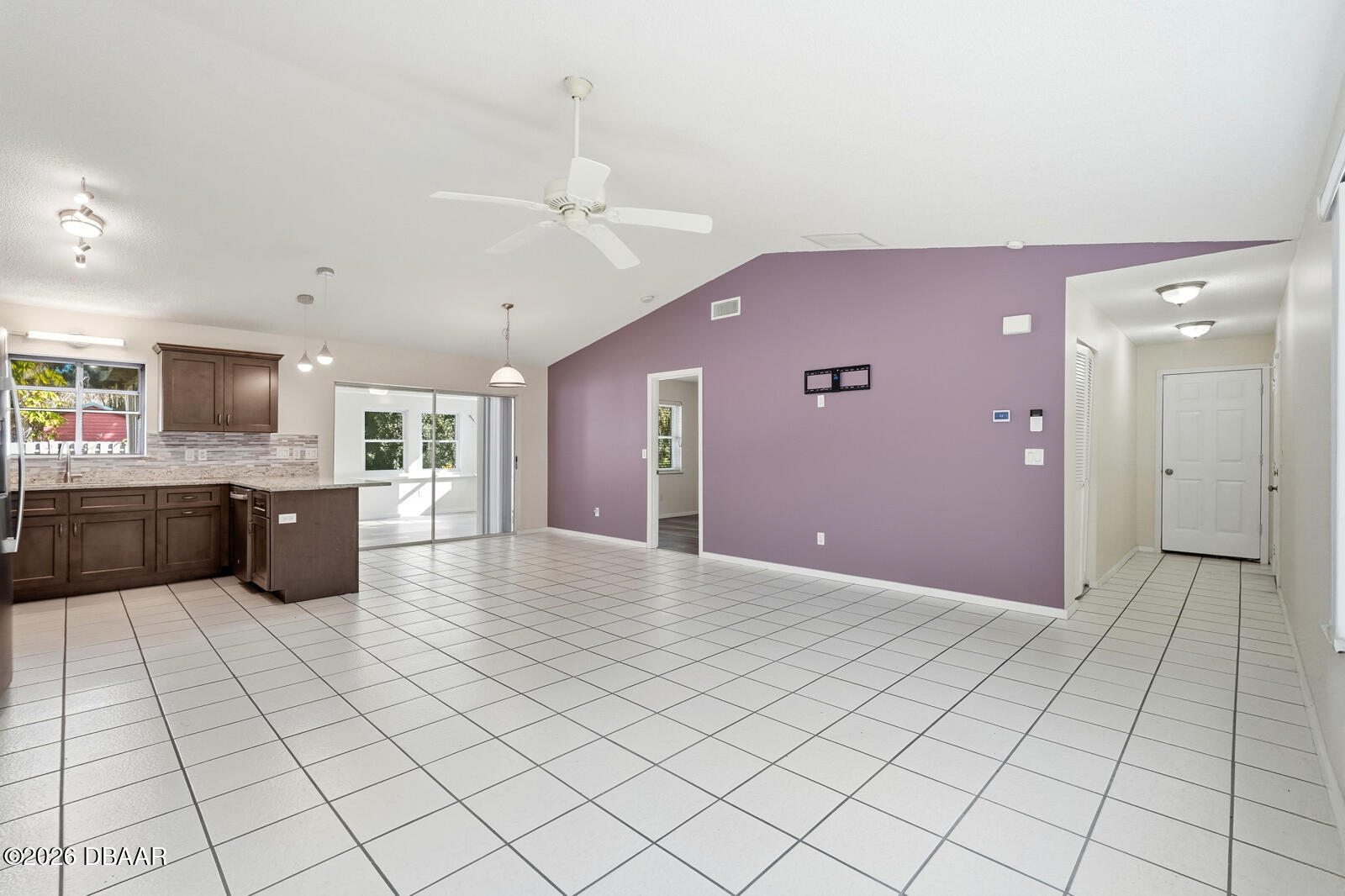 550 Locust Street Port Orange, FL 32127 - Photo 5 of 37 a open kitchen with a sink dishwasher and a refrigerator