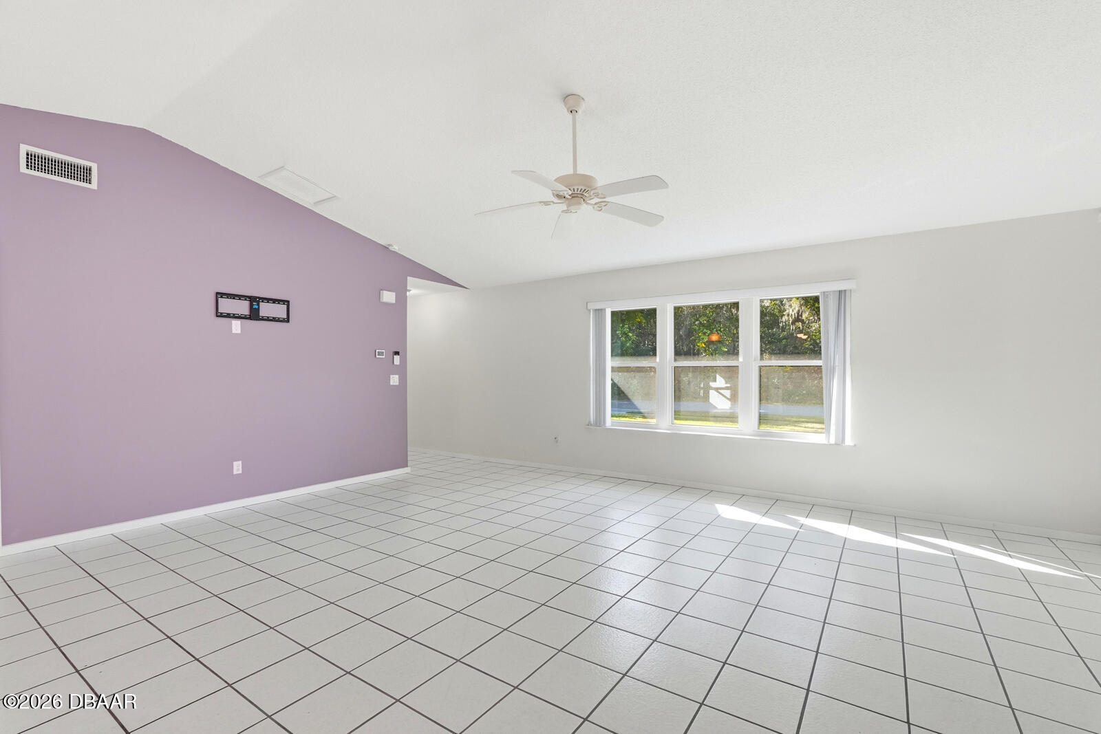 550 Locust Street Port Orange, FL 32127 - Photo 6 of 37 a view of an empty room with a window