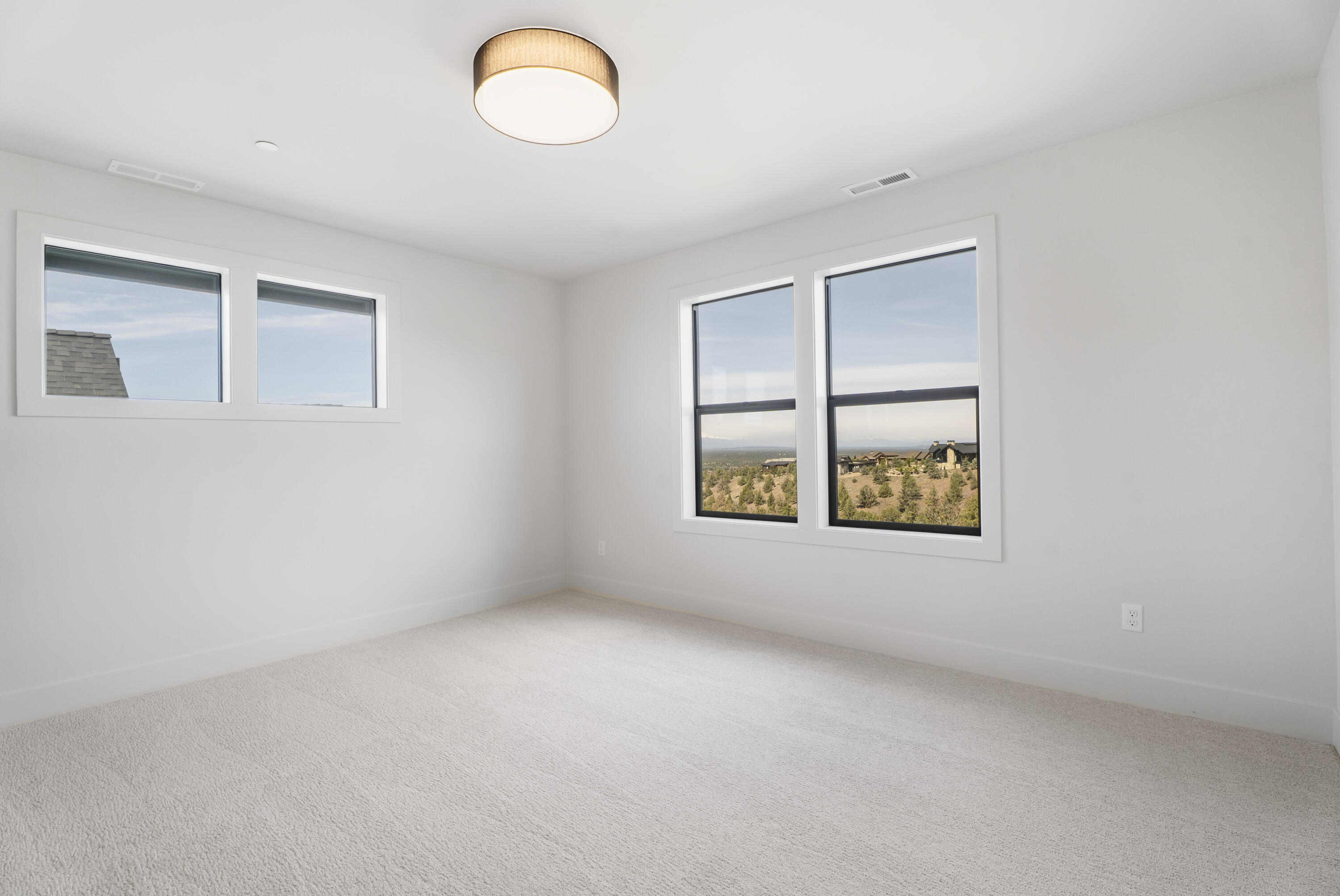 16883 Southwest Paragon Court Powell Butte, OR 97753 - Photo 34 of 42 The fourth bedroom of the home has arguably some of the best views to the northwest from the top floor