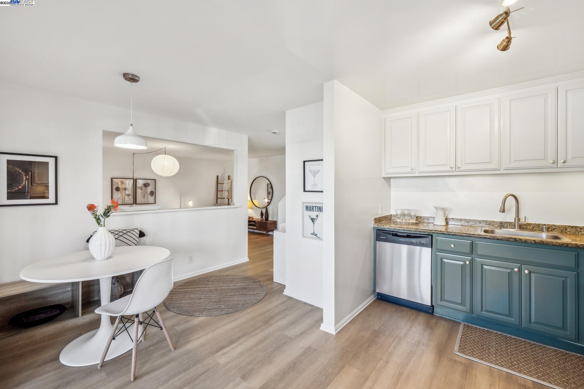 700 Fargo Avenue, Unit 2 San Leandro, CA 94579 - Photo 12 of 39 a kitchen with granite countertop a sink cabinets and wooden floor
