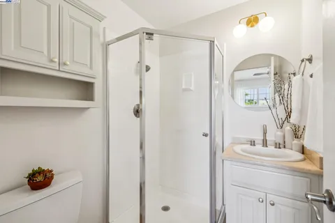 a bathroom with a shower and a sink