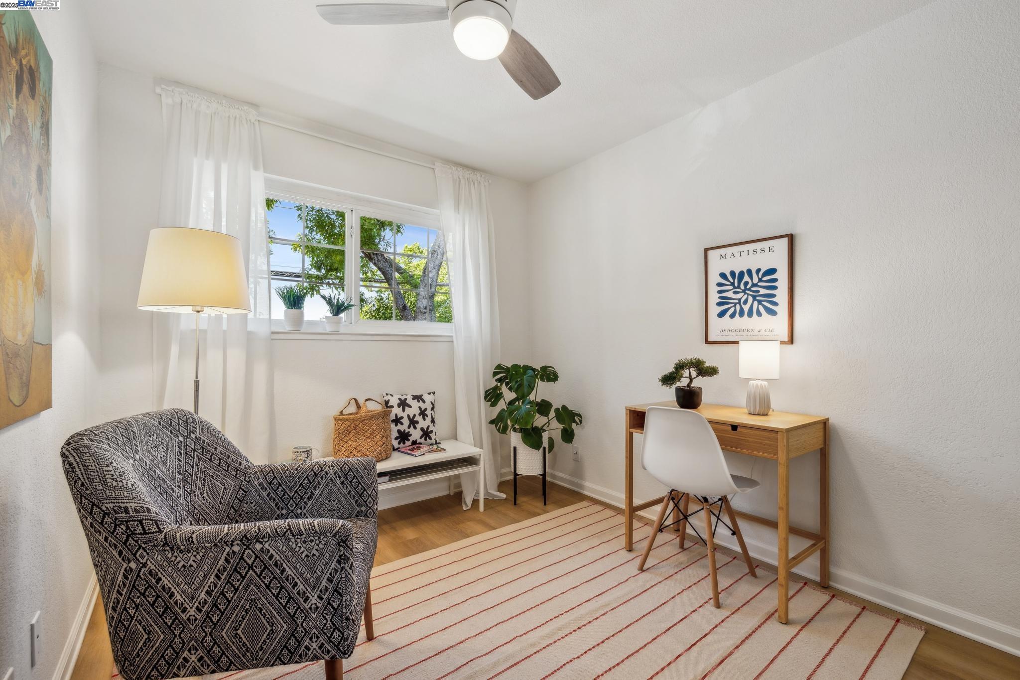 700 Fargo Avenue, Unit 2 San Leandro, CA 94579 - Photo 27 of 39 a living room with furniture and a wooden floor