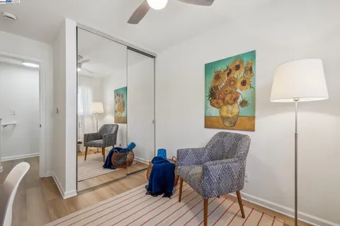 a living room with furniture and a lamp