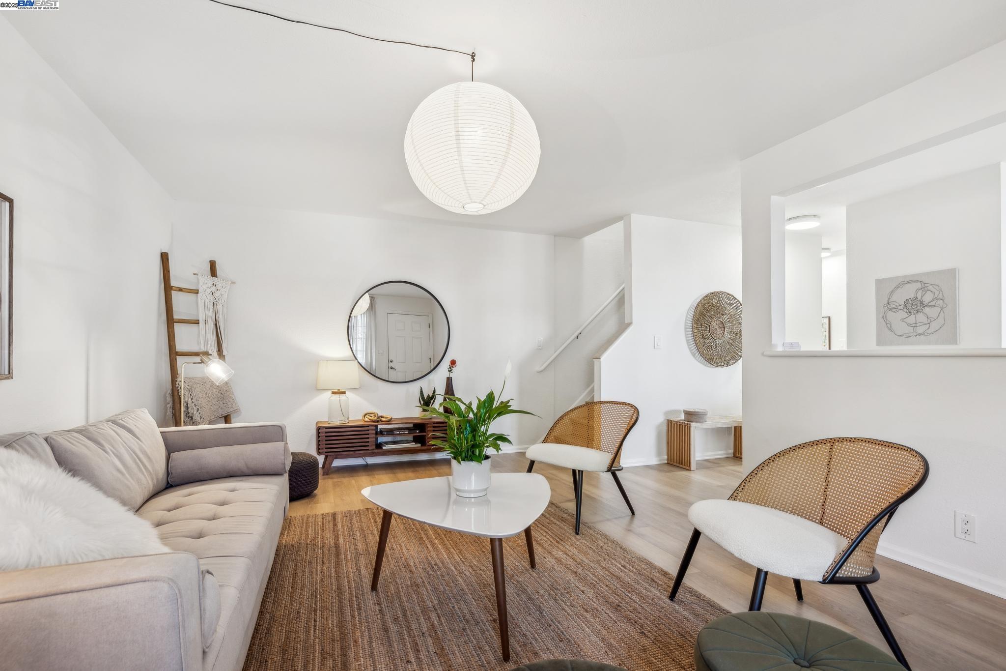 700 Fargo Avenue, Unit 2 San Leandro, CA 94579 - Photo 4 of 39 a living room with furniture kitchen view and a mirror