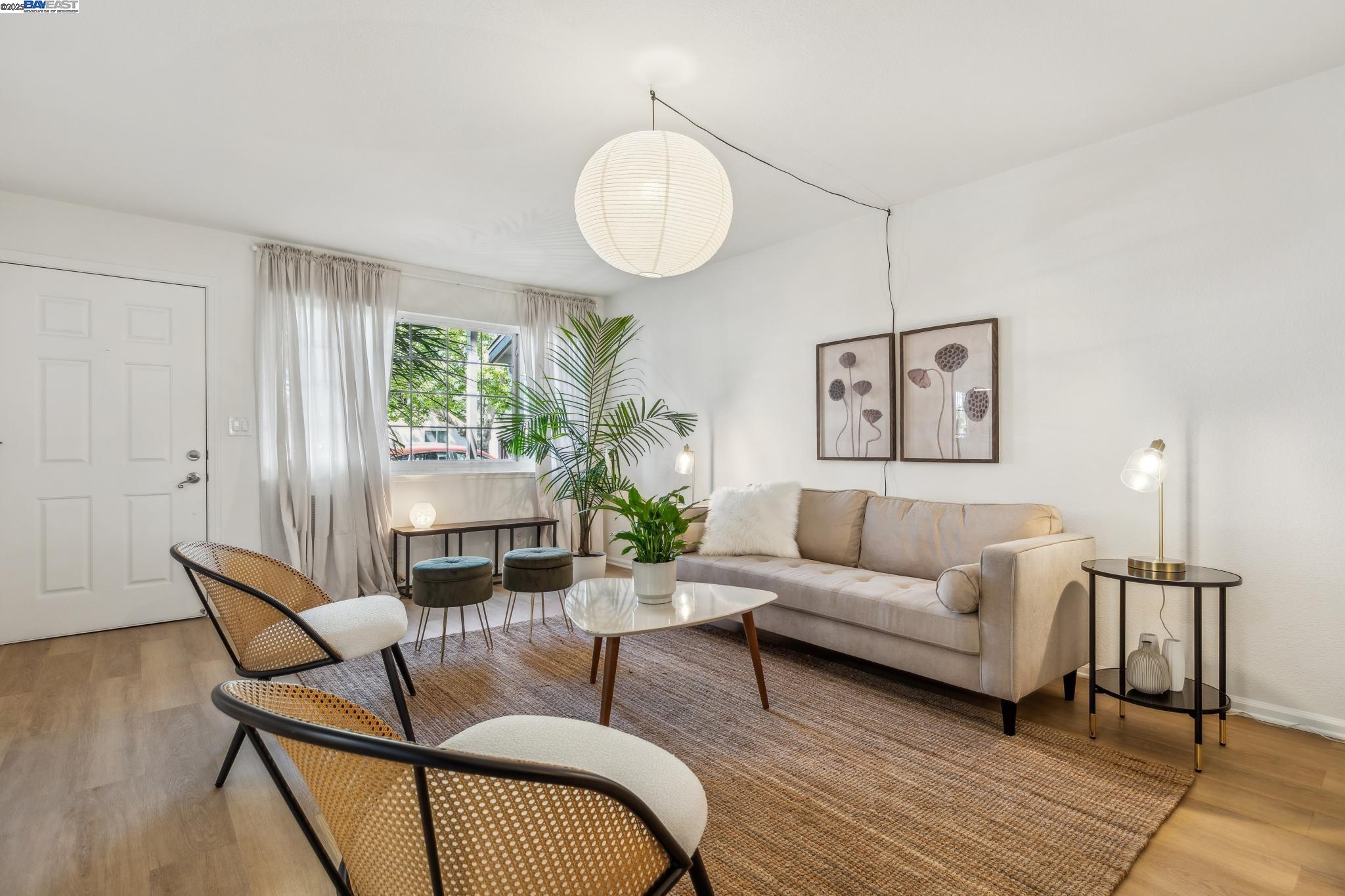 700 Fargo Avenue, Unit 2 San Leandro, CA 94579 - Photo 6 of 39 a living room with furniture and a wooden floor