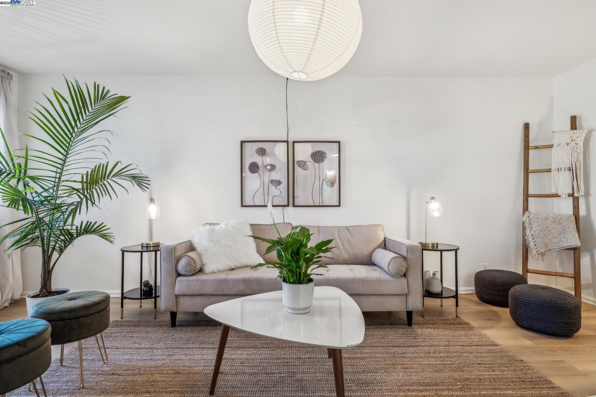 700 Fargo Avenue, Unit 2 San Leandro, CA 94579 - Photo 8 of 39 a living room with furniture potted plant and a chandelier
