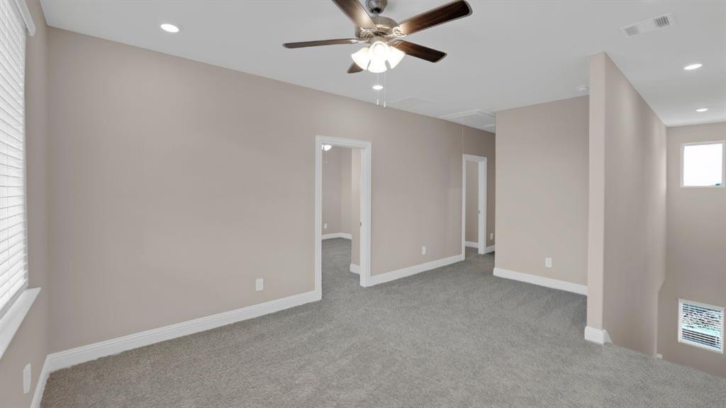 1512 Dulwich Drive Allen, TX 75013 - Photo 20 of 22 an empty room with closet and a chandelier fan