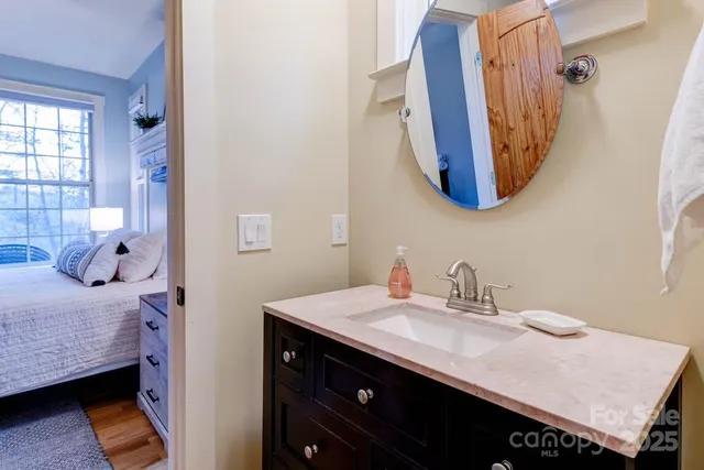 a en suite bathroom with a sink and mirror