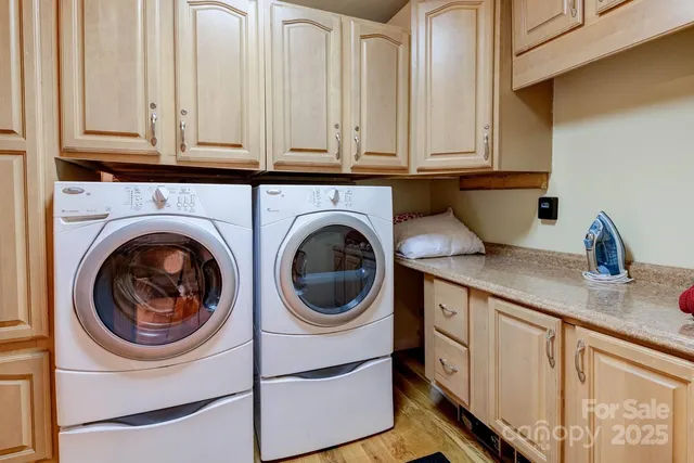 a utility room with sink dryer and washer