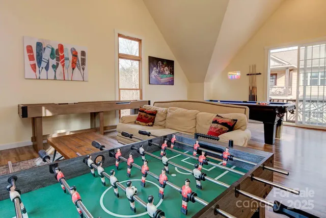 a bed room with furniture and painting on the wall