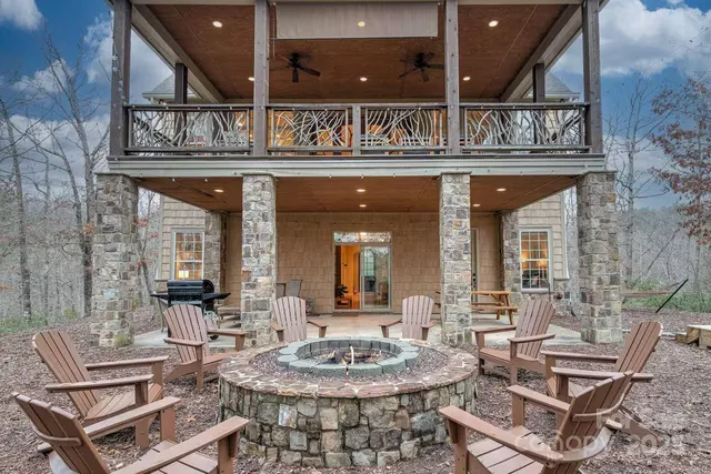 a outdoor living area with a couch and chairs