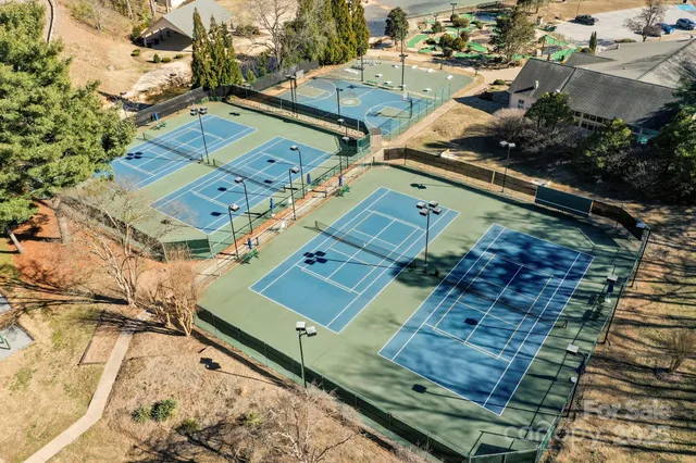 a swimming pool with outdoor seating and yard