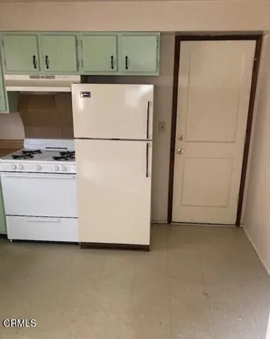 a utility room with washer and dryer