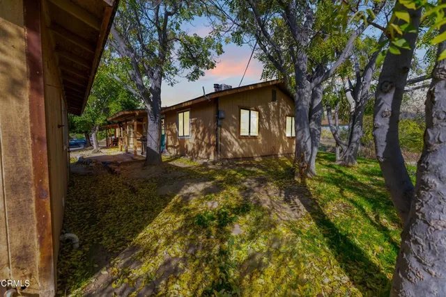 a backyard of a house with lots of green space