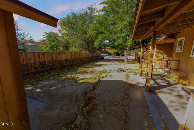 a view of a backyard of the house