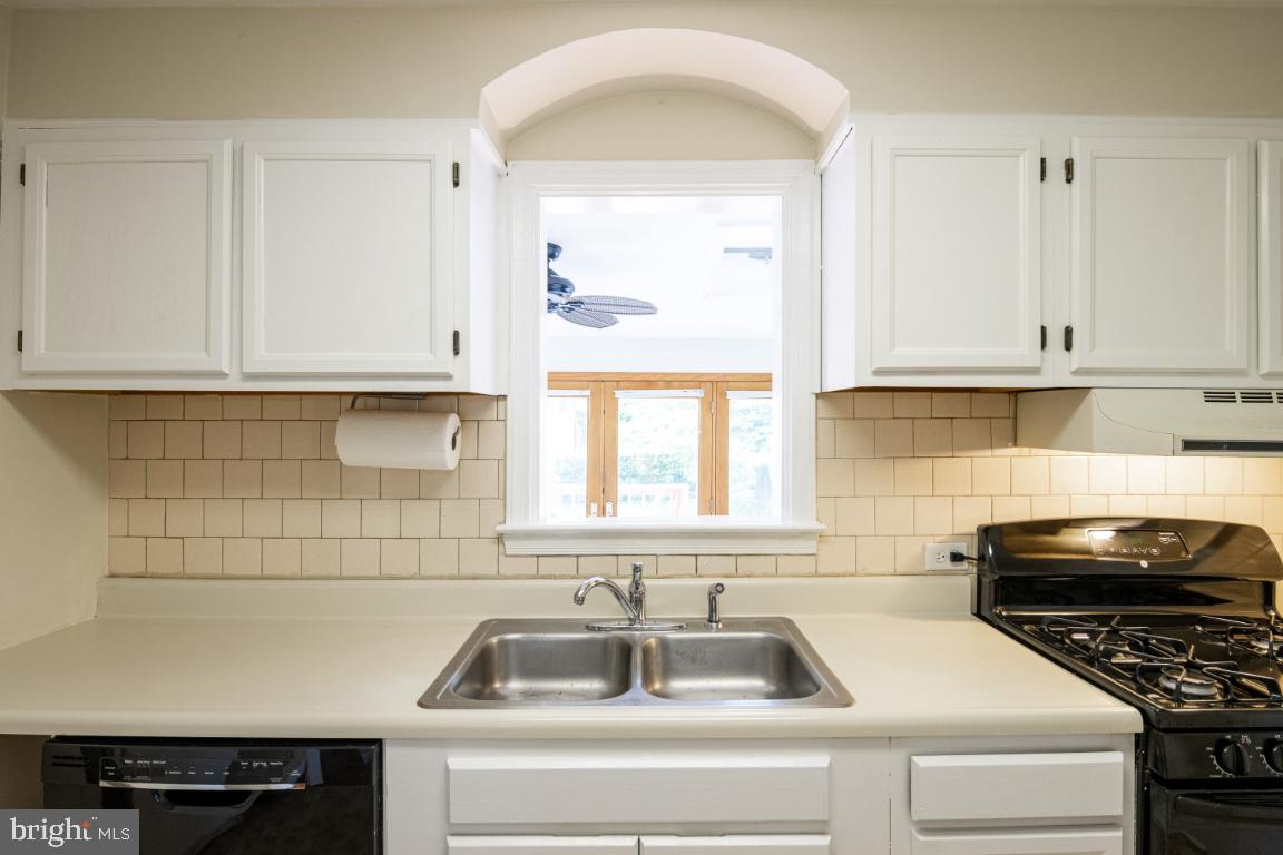 6402 Sharon Road Baltimore, MD 21239 - Photo 13 of 56 Kitchen with Cutout to Family Room