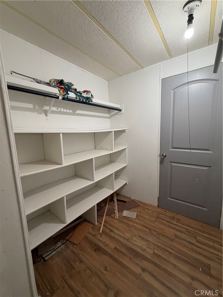 4047 Foothill Drive Lucerne, CA 95458 - Photo 50 of 75 a room with walk in closet and wooden floor