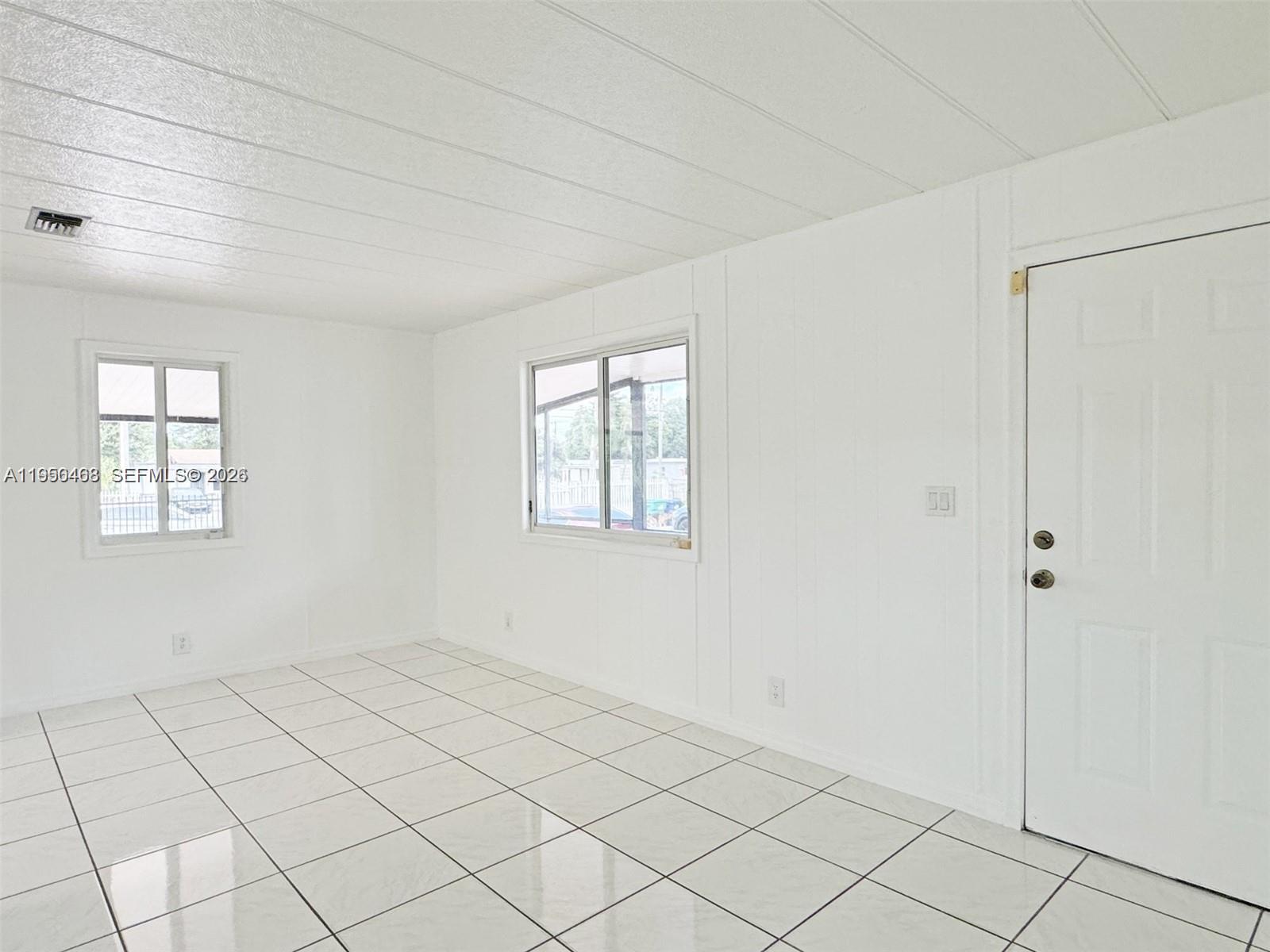2982 Northwest 95th Street Miami, FL 33147 - Photo 14 of 30 a view of an empty room and window