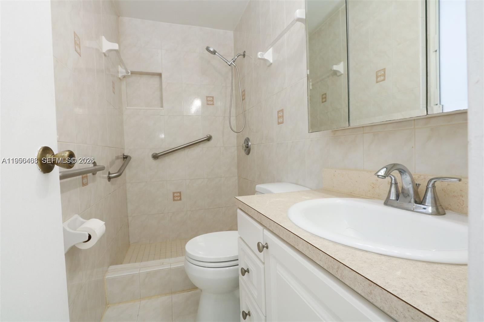 2982 Northwest 95th Street Miami, FL 33147 - Photo 21 of 30 a bathroom with a sink toilet and shower