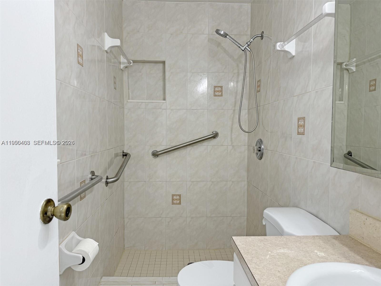 2982 Northwest 95th Street Miami, FL 33147 - Photo 22 of 30 a bathroom with a granite countertop shower sink and toilet