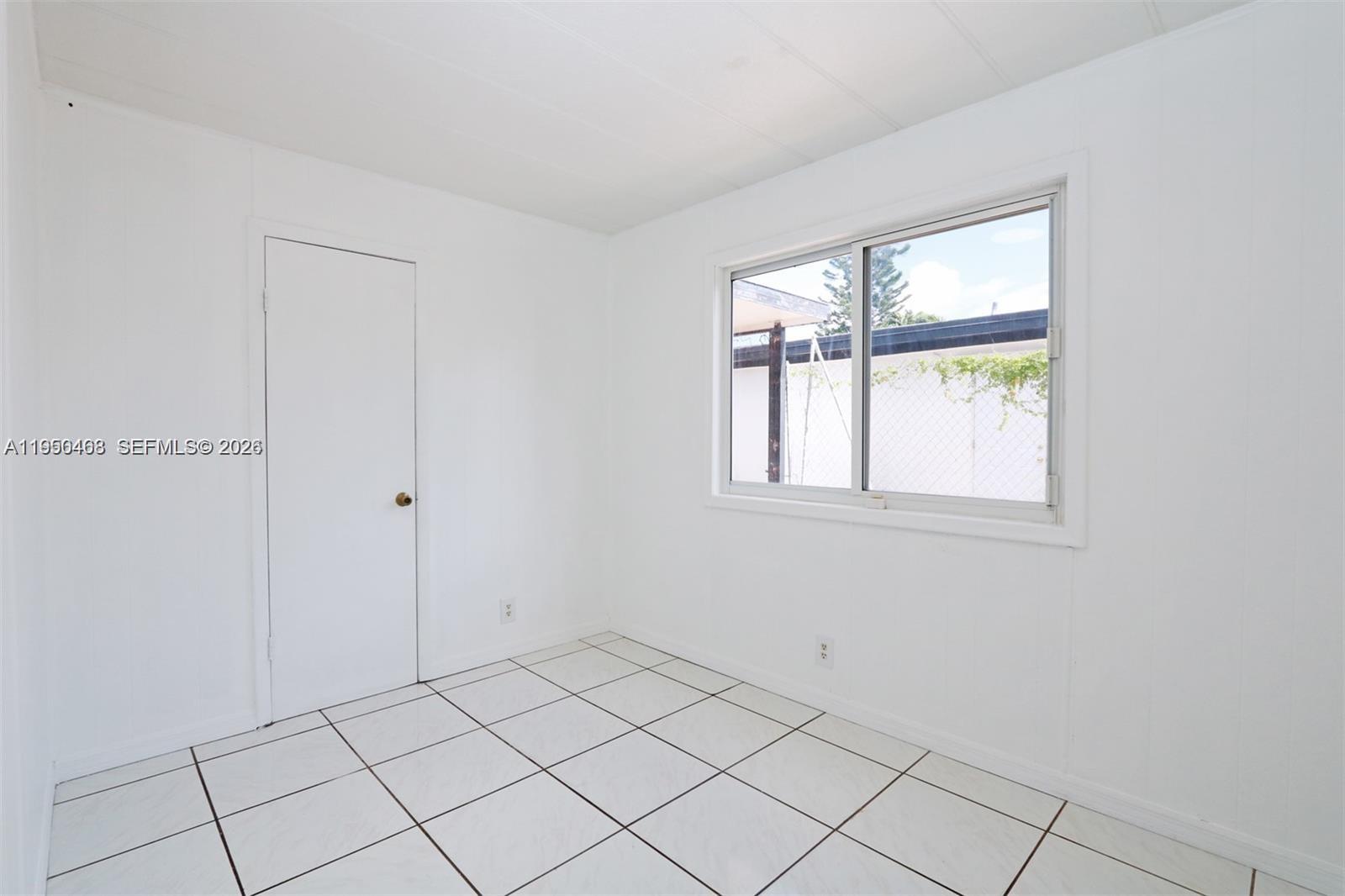 2982 Northwest 95th Street Miami, FL 33147 - Photo 24 of 30 a view of an empty room and window