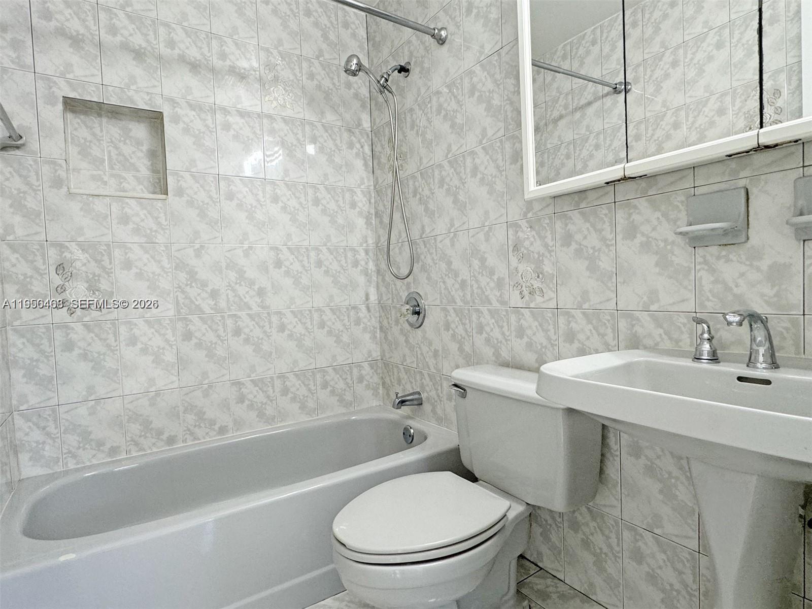 2982 Northwest 95th Street Miami, FL 33147 - Photo 25 of 30 a bathroom with a sink toilet and shower