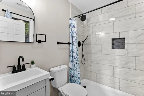 a view of a livingroom with furniture and a window