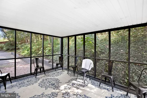 a view of an empty room with a large window