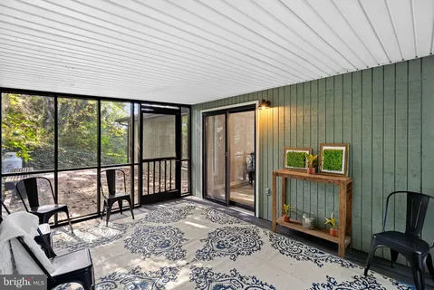 a view of a room with wooden walls