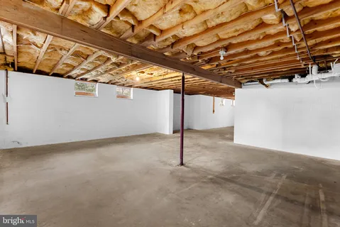 a bench sitting in the middle of a forest