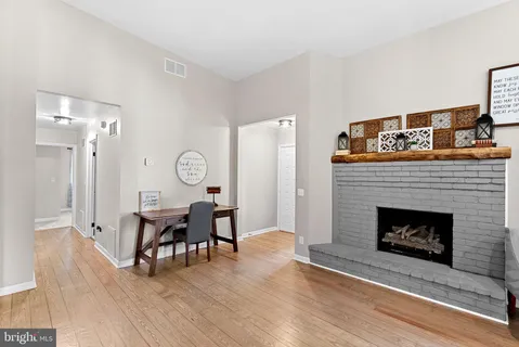 a view of a livingroom with furniture and a fireplace