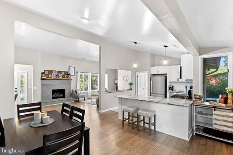 a open kitchen with sink cabinets and wooden floor