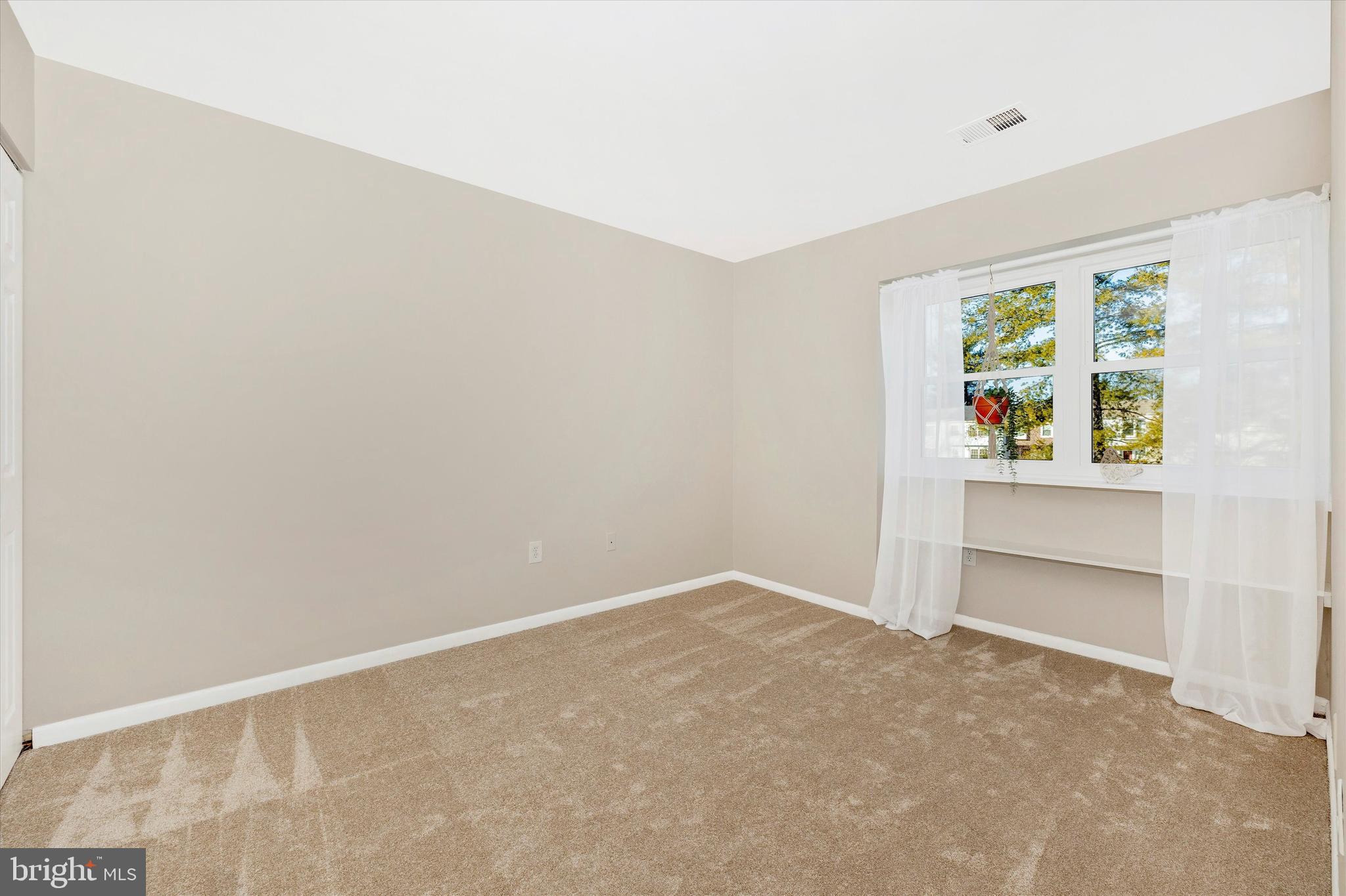 17513 Hoskinson Road Poolesville, MD 20837 - Photo 26 of 44 a view of an empty room with a window