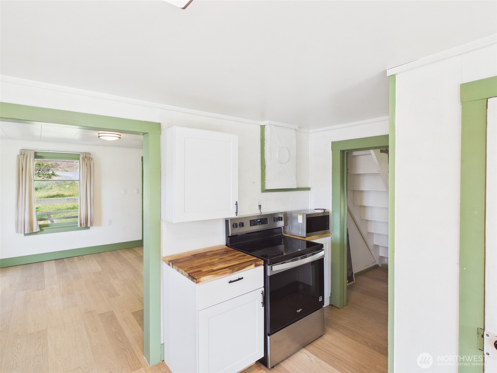 50 Klondike Road Republic, WA 99166 - Photo 7 of 18 a kitchen with a stove and a white cabinet