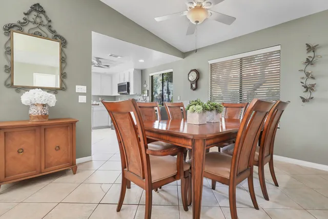 a dining room with furniture and window