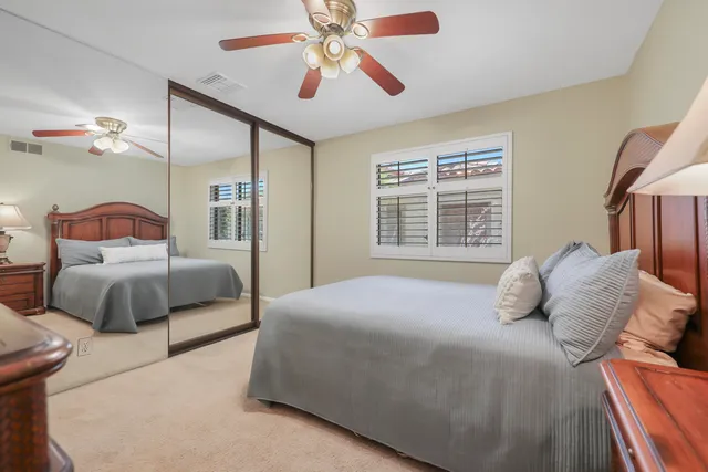 a bathroom with a double vanity sink toilet and shower