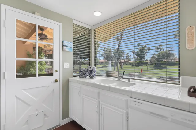 a bathroom with a sink and a window