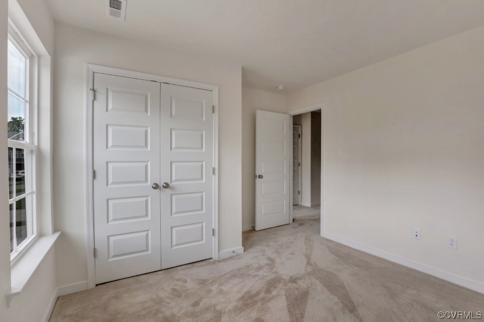12867 Deep Wl Road Midlothian, VA 23112 - Photo 18 of 40 an empty room with windows and closet