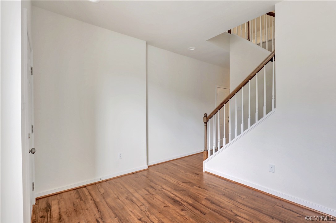 12867 Deep Wl Road Midlothian, VA 23112 - Photo 2 of 40 a view of a hallway with wooden floor and entryway