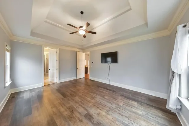 a spacious bathroom with a shower sink and mirror