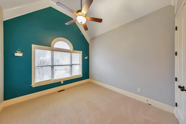 a bathroom with a granite countertop tub sink and mirror