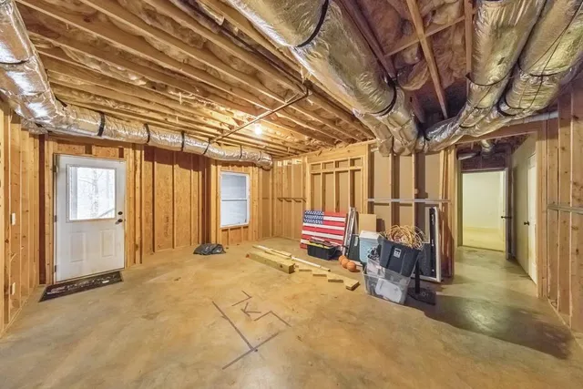a view of a porch with wooden floor and iron stairs