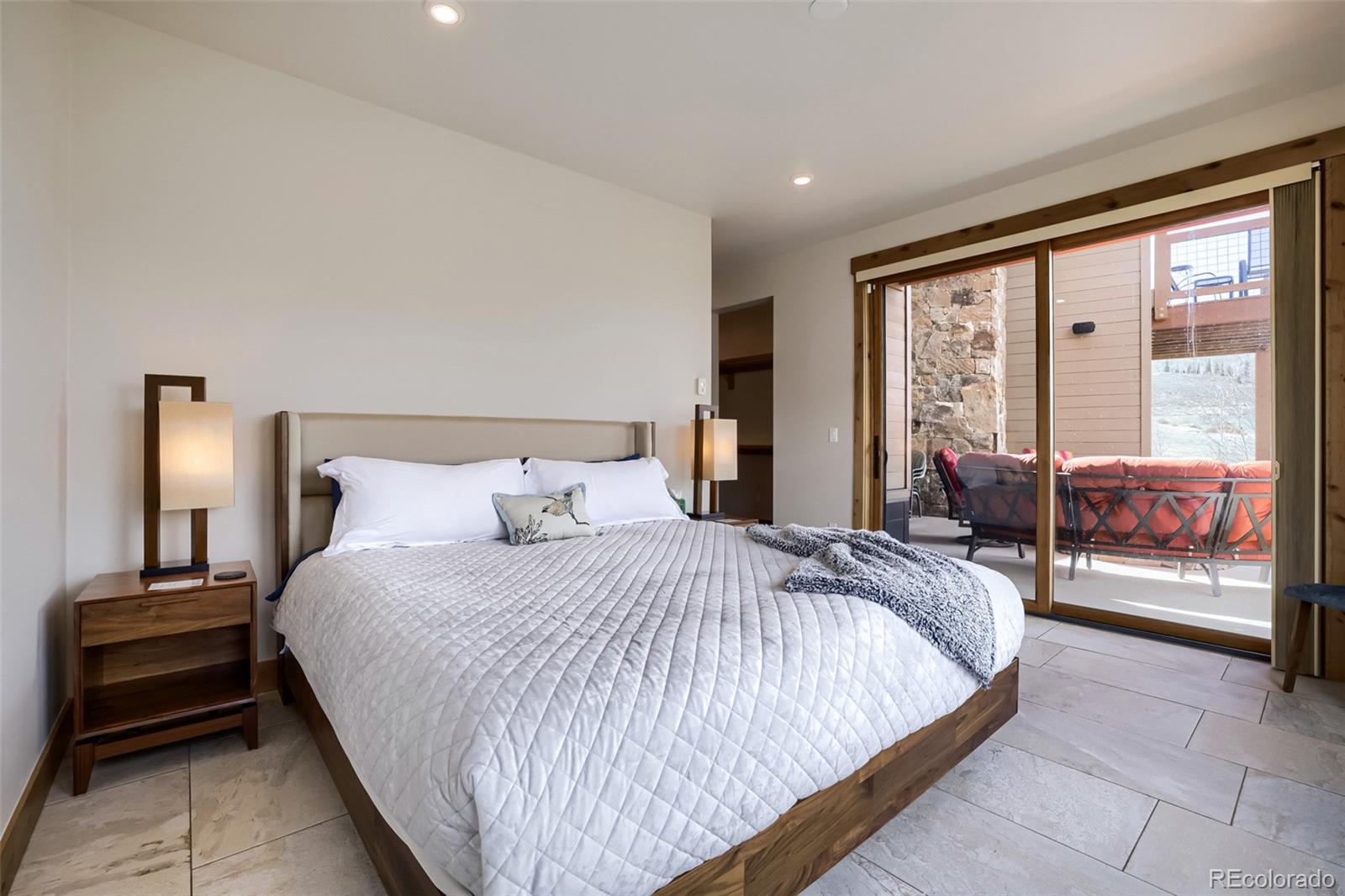 836 Maryland Creek Road Silverthorne, CO 80498 - Photo 20 of 49 a bedroom with a bed and large window