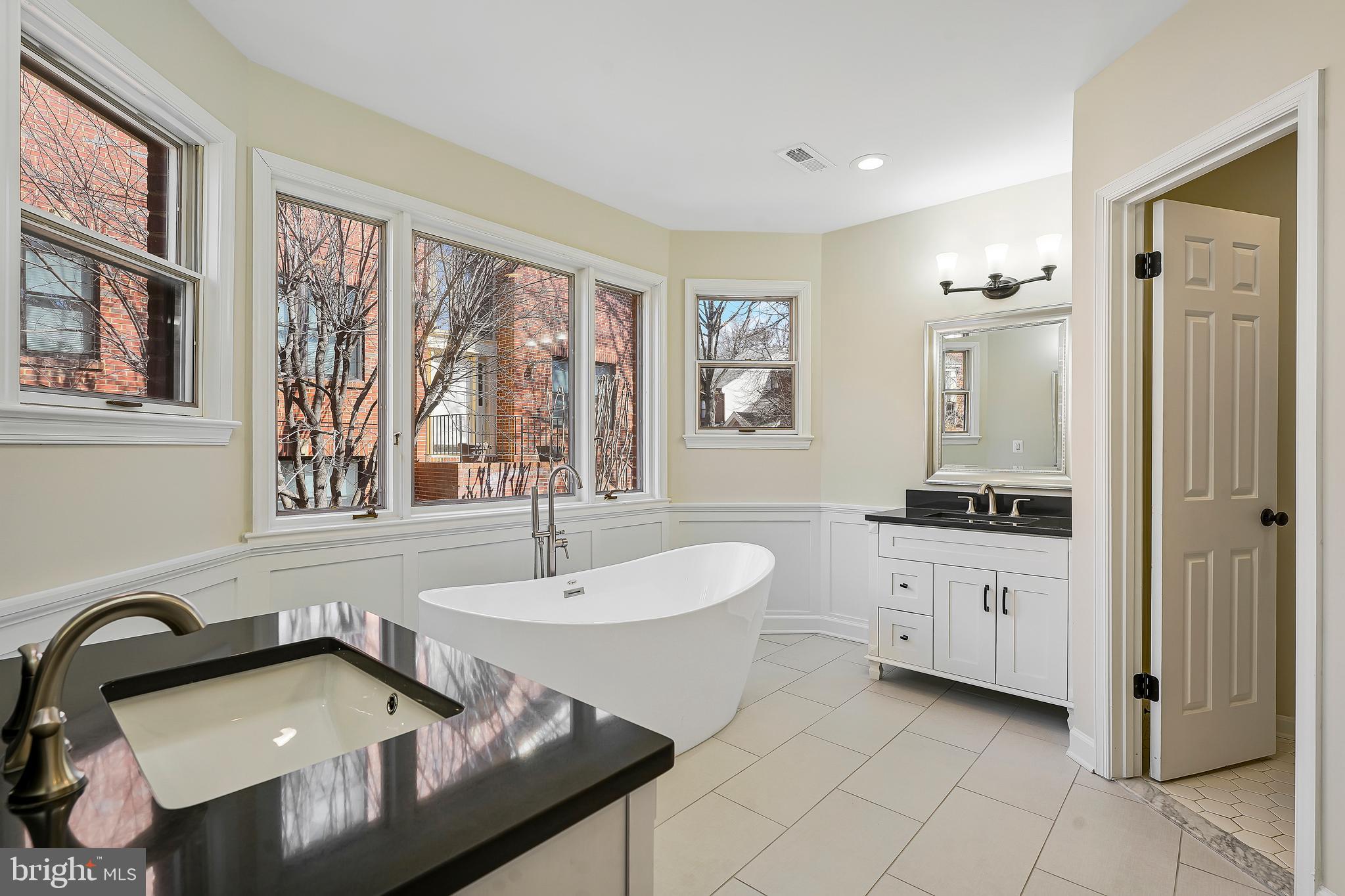 1469 Hampton Hill Circle McLean, VA 22101 - Photo 25 of 62 a bathroom with a sink double vanity and a tub