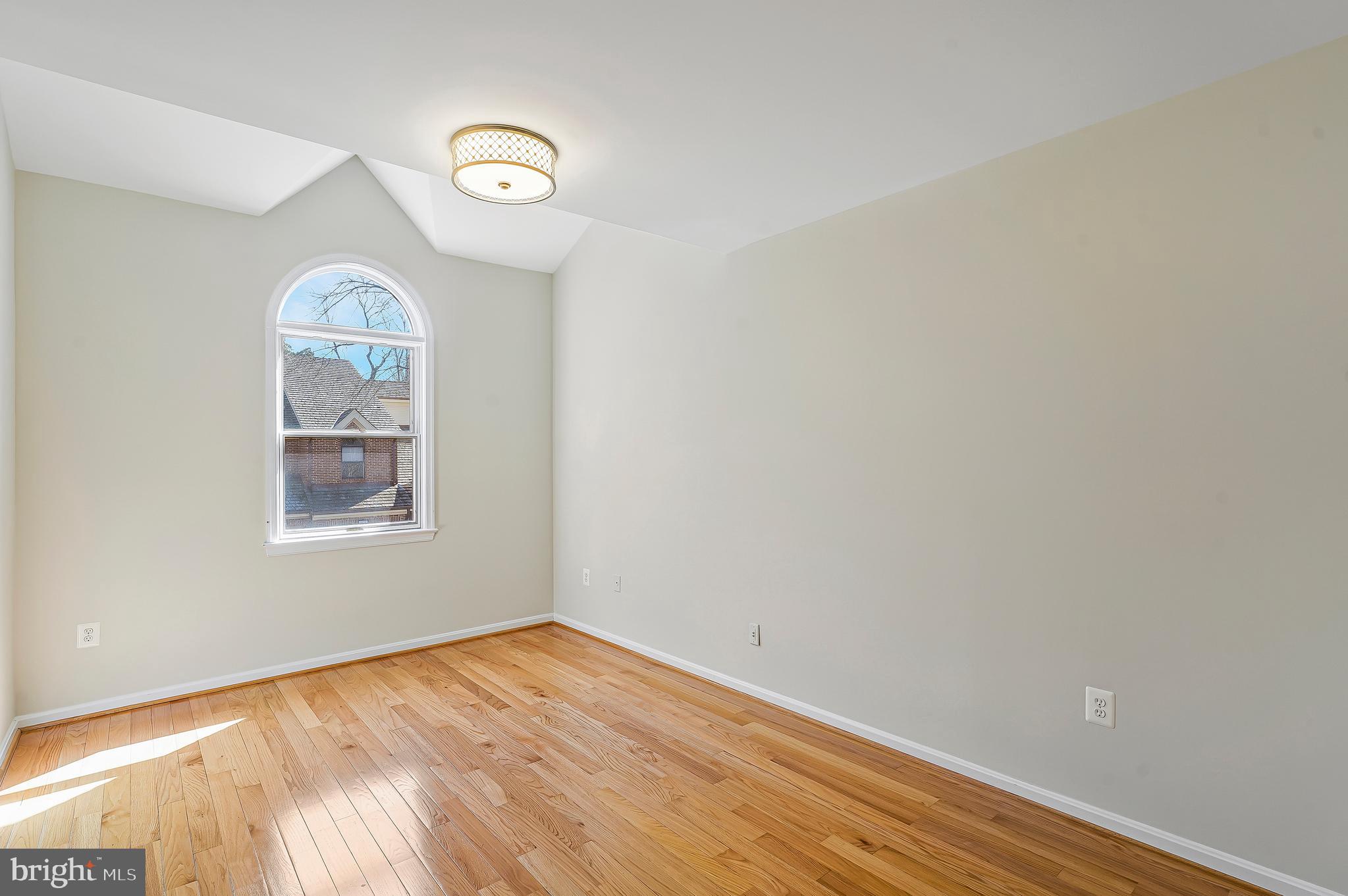 1469 Hampton Hill Circle McLean, VA 22101 - Photo 29 of 62 a view of empty room with wooden floor and fan