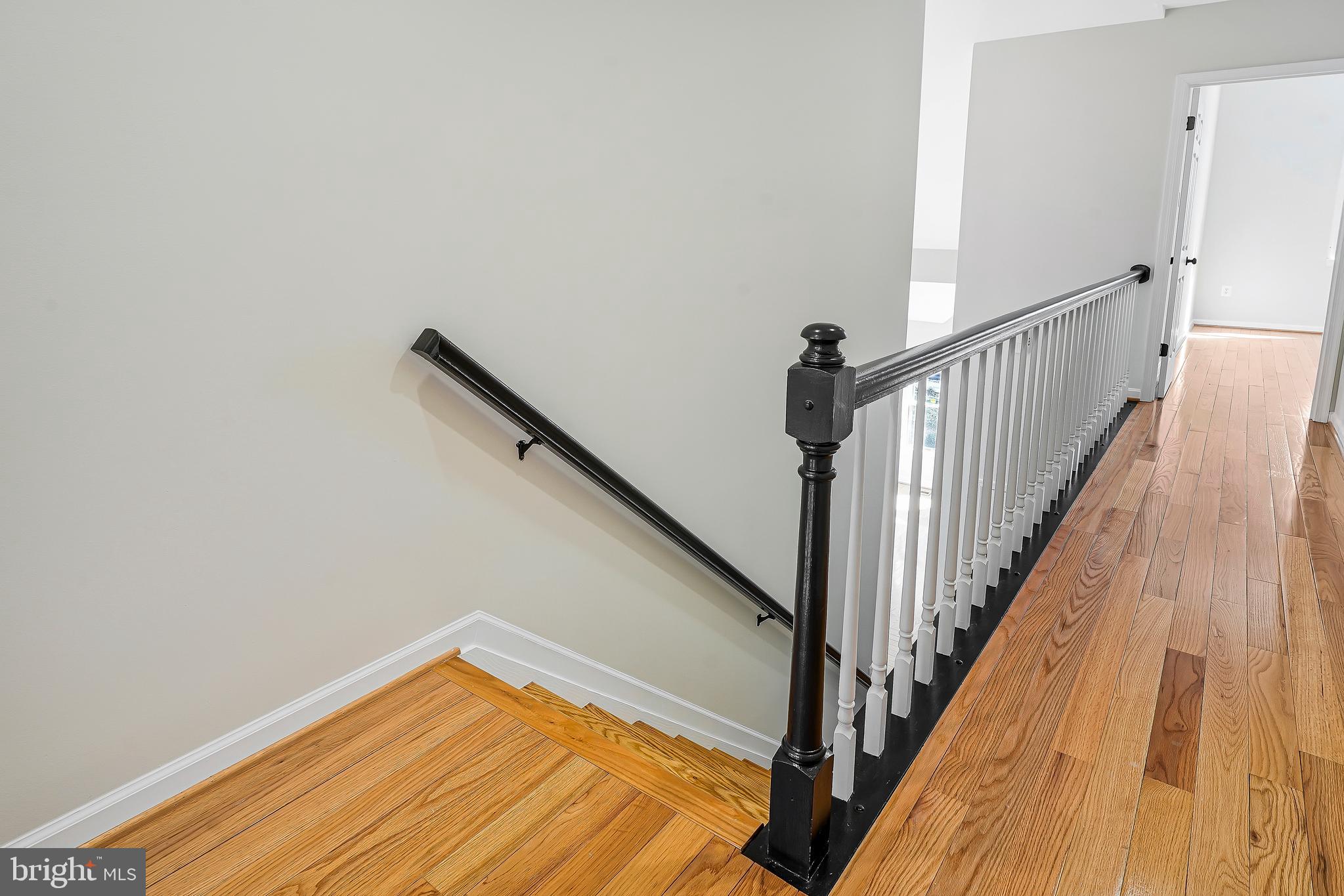 1469 Hampton Hill Circle McLean, VA 22101 - Photo 60 of 62 a view of a hallway with wooden floor and staircase
