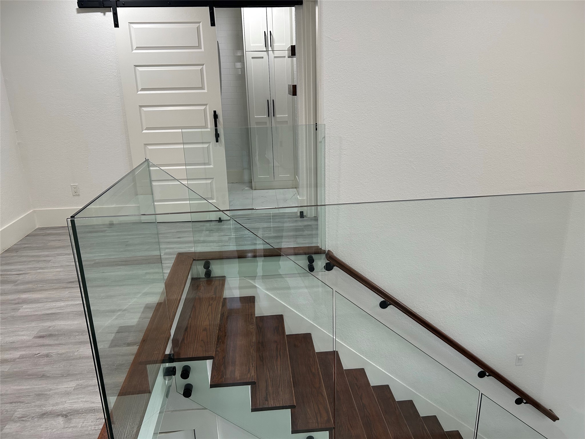 16346 St Helena Way Houston, TX 77053 - Photo 12 of 33 GLASSED BALCONY AT TOP OF STAIRWAY